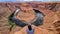 Horseshoe Bend - Tourist man with panoramic aerial view of Horseshoe bend on the Colorado river near Page in summer, Arizona, USA