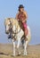 Horsewoman on the beach