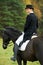 Horsewoman jockey in uniform with horse