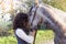 horsewoman kisses his horse to the country