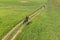 Horsewoman On A Seal Brown Horse Moving Across The Beautiful Farm Field Meadows