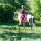 Horsewoman on white horse