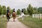 Horsewomen riding horses at the equestrian center on a summer day