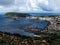 Horta city view as seen from the Nossa Senhora da ConceiÃ§Ã£o , showing the marina, the old dock, and volcanic cones,