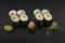 Hosomaki sushi rolls with avocado decorated with wasabi