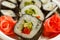 Hosomaki with vegetables. Sushi roll with nori, rice, avocado and bell pepper