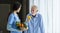 Hospice nurse and nutritionist is suggesting variety of vegetable to Caucasian man at pension retirement center for home care