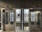 A hospital parking deck urban spooky elevator looking through a window at cityscape