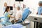 Hospital staff preparing pregnant patient to examination before childbirth