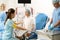 Hospital staff preparing pregnant patient to examination before childbirth