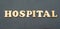 Hospital written on a black background.