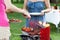 Host serving meals on barbecue party