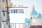 HOSTEL signboard on a white background at city