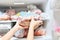 The hostess woman takes out frozen meat in bags from the freezer