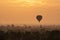 Hot air ballons over pagodas in sunrise at Bagan