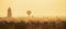 Hot air ballons over pagodas in sunrise at Bagan