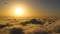 Hot air balloon above the clouds in sunrise