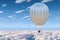 Hot air balloon, aerostat in the blue sky above the clouds. 3D rendering