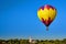 Hot air balloon against a deep blue sky