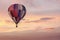 Hot Air Balloon in Colorful Pink Sunrise Sky