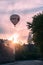 A hot air balloon decorated with the newspaper Sydsvenskan logo during sunset in Lund Sweden