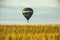 Hot Air Balloon Floats Above Iowa Cornfield