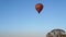 Hot air balloon flying far away