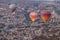 Hot air balloon flying over spectacular Cappadocia, Tourists enjoy the overwhelming views over Cappadocia, Turkey