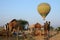 Hot air balloon flying over tribal nomad camel camp,India
