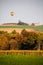 Hot air balloon flying over Wisconsin farmland in late September