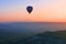 Hot air balloon flying at sunrise, Cappadocia, Turkey