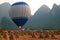 Hot air balloon among the hills and rice fields, Yangshuo, China