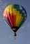Hot air balloon launching against a blue sky