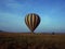 Hot air balloon over fields