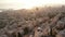 Hot air balloon over Haifa cityscape, port, and Haifa bay at sunrise.