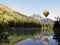 Hot air balloon over lake