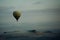 Hot Air Balloon Over Mountains