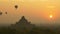 Hot air balloon over plain of Bagan at sunrise, Myanmar