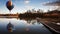 Hot air balloon over sunset lake with jetty