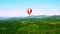Hot-air balloon with passengers in the sky