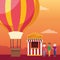 Hot air balloon and people standing next to a carnival ticket booth