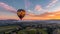 a hot air balloon ride at dawn, as it glides gracefully over a picturesque landscape of rolling hills and vineyards.