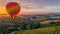 a hot air balloon ride at dawn, as it glides gracefully over a picturesque landscape of rolling hills and vineyards.