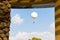 Hot air balloon soaring sky window view.