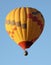 A Hot Air Balloon Soars in a Blue Sky