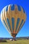 Hot air balloon with tourists landing in Cappadocia Turkey