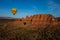 Hot air ballooning over sedona Arizona showing balloon and butte