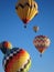 Hot air balloons against blue sky