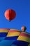 Hot air balloons against brilliant blue skies
