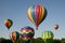 Hot-air balloons ascending or launching at a ballooning festival